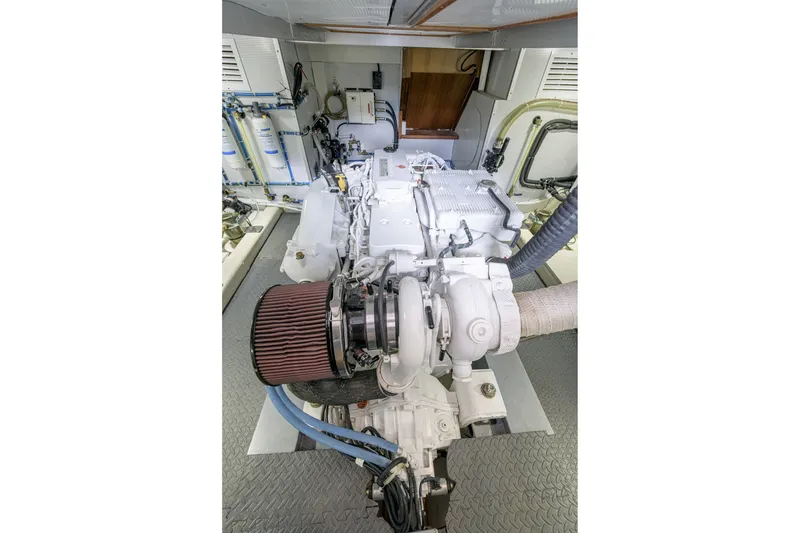 Slide: The Image of Engine room of 2017 North Pacific 49 Pilothouse with visible machinery and components. - 38