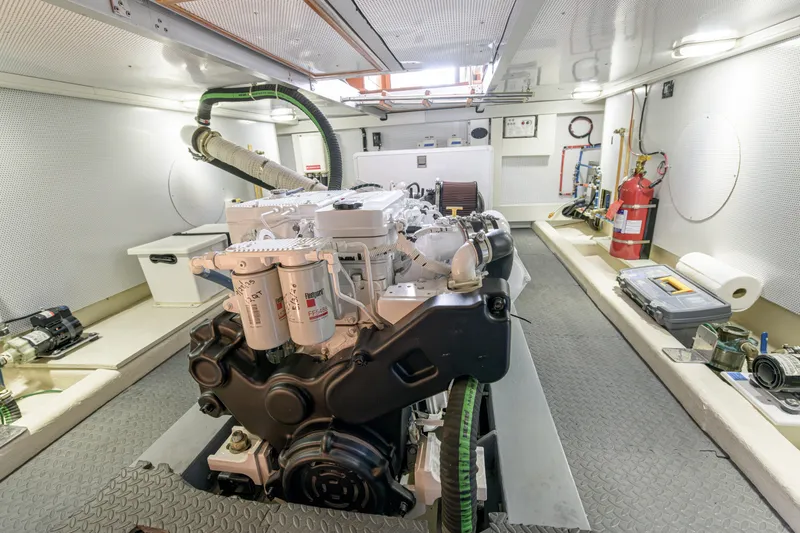 Slide: The Image of Engine room of 2017 North Pacific 49 Pilothouse yacht, featuring a well-maintained engine. - 39