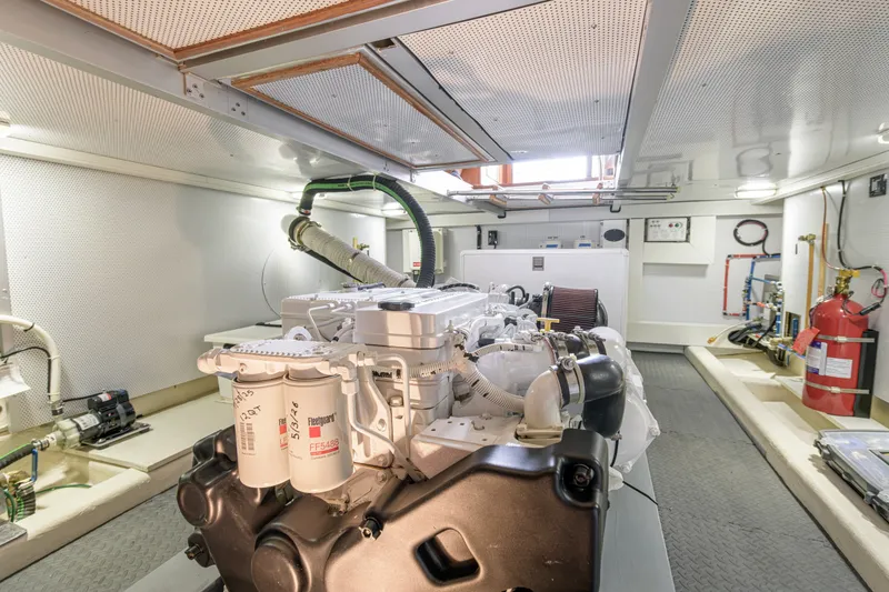 Slide: The Image of Engine room of 2017 North Pacific 49 Pilothouse yacht, showcasing machinery and equipment. - 41