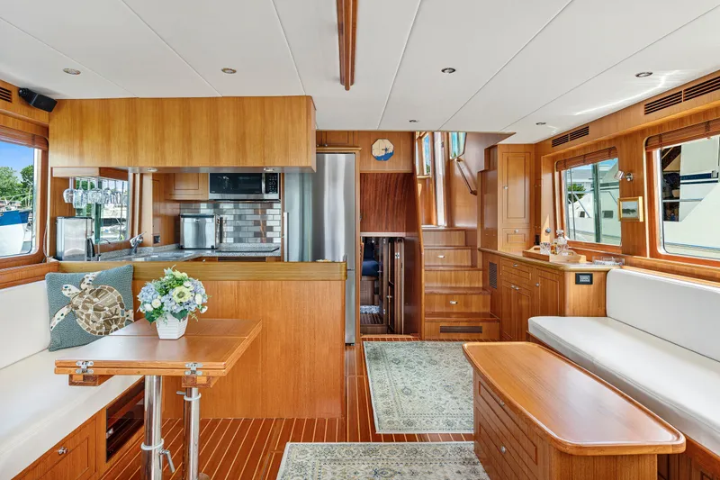 Slide: The Image of Luxurious interior of 2017 North Pacific 49 Pilothouse yacht with elegant wood finishes. - 2