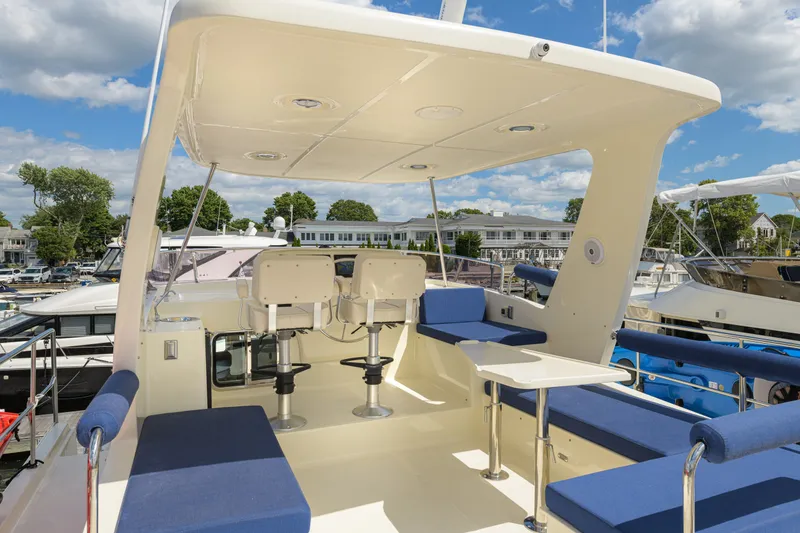 Slide: The Image of Luxurious 2017 North Pacific 49 Pilothouse yacht with spacious outdoor seating area. - 66