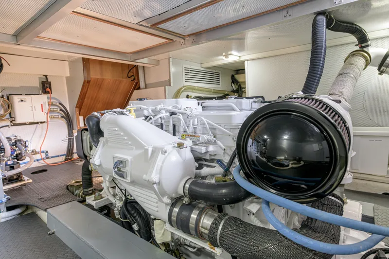 Slide: The Image of Engine room of 2017 North Pacific 49 Pilothouse yacht, showcasing machinery and components. - 35
