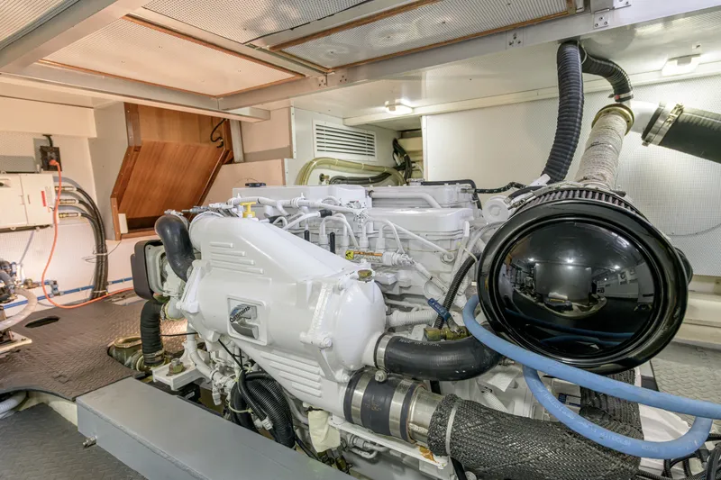 Slide: The Image of Engine room of 2017 North Pacific 49 Pilothouse yacht, showcasing a powerful marine engine. - 36