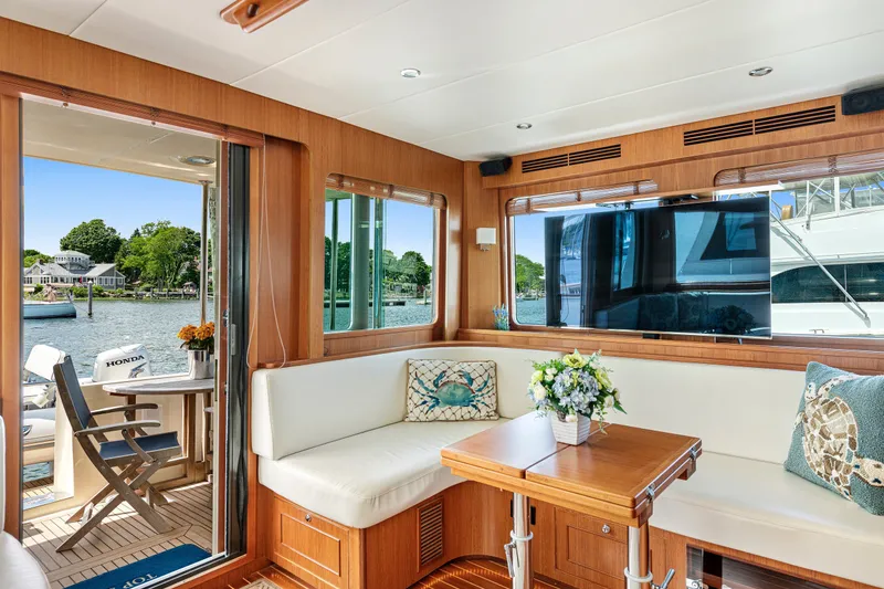 Slide: The Image of Luxurious interior of 2017 North Pacific 49 Pilothouse yacht with scenic water view. - 15
