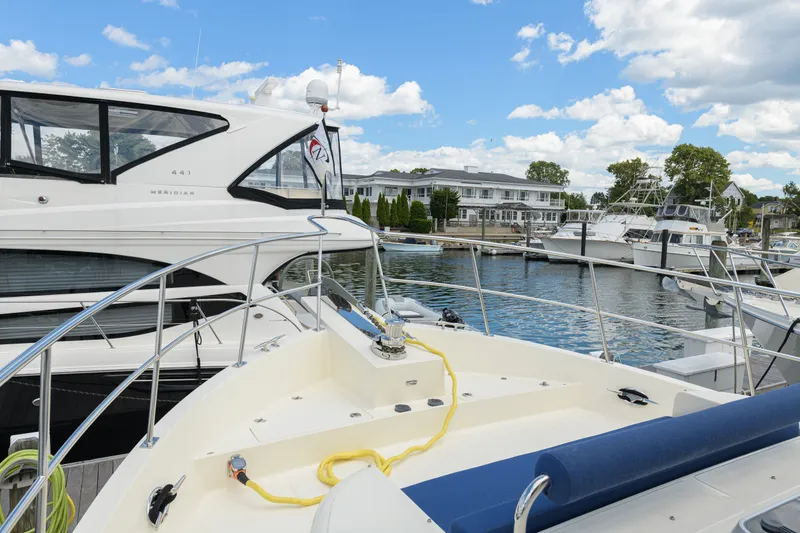 Slide: The Image of 2017 North Pacific 49 Pilothouse yacht docked at marina with clear skies. - 74