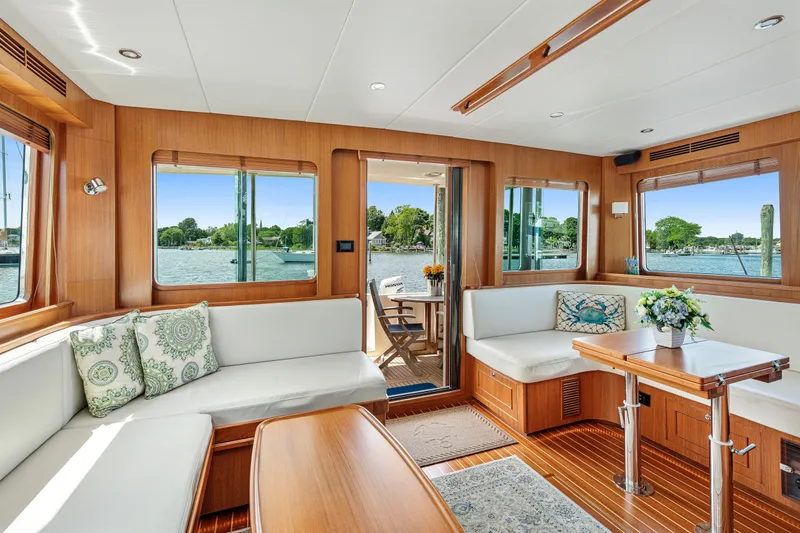 Slide: The Image of Luxurious interior of 2017 North Pacific 49 Pilothouse yacht with scenic water views. - 5