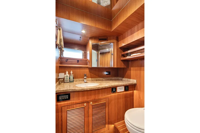 Slide: The Image of Luxurious wooden bathroom interior of 2017 North Pacific 49 Pilothouse yacht. - 20
