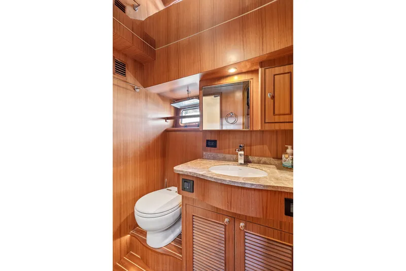 Slide: The Image of Luxurious wooden bathroom interior of 2017 North Pacific 49 Pilothouse yacht. - 28