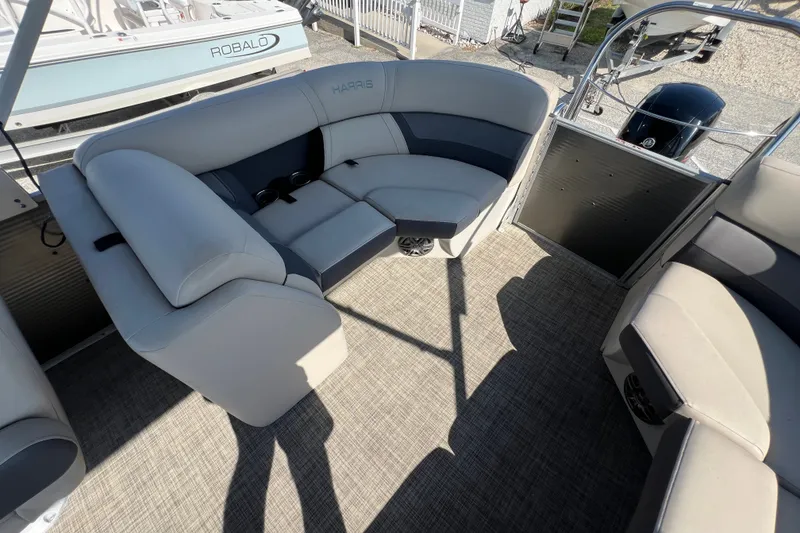 Slide: The Image of 2023 Harris Cruiser 230 boat interior with plush seating and modern design. - 12