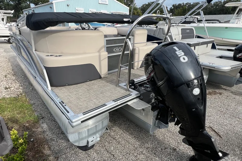 Slide: The Image of 2023 Harris Cruiser 230 pontoon boat with Mercury 150 outboard motor. - 4