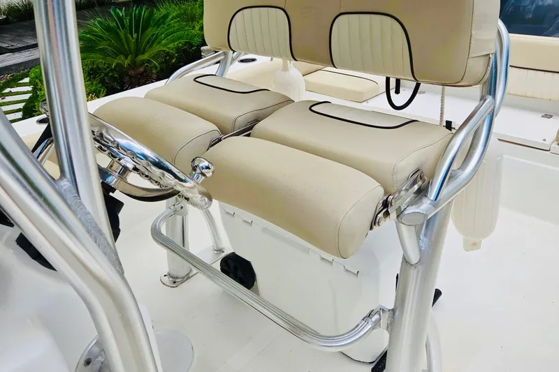 Slide: The Image of 2017 Sea Fox 249 Avenger boat helm with beige seating and stainless steel details. - 4