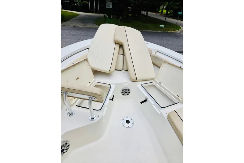 Slide: The Image of 2017 Sea Fox 249 Avenger boat interior with beige seating and storage compartments. - 9