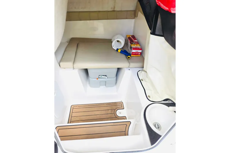 Slide: The Image of Interior of 2017 Sea Fox 249 Avenger boat with storage and seating area. - 11