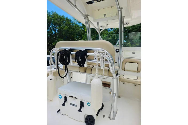 Slide: The Image of 2017 Sea Fox 249 Avenger boat interior with seating, cooler, and ropes. - 3