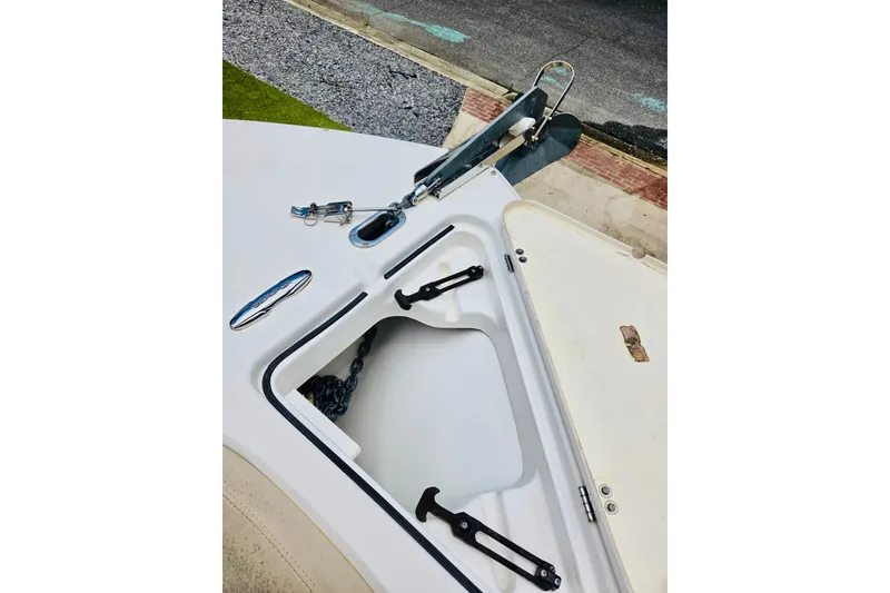 Slide: The Image of 2017 Sea Fox 249 Avenger boat anchor compartment with chain and hardware. - 10