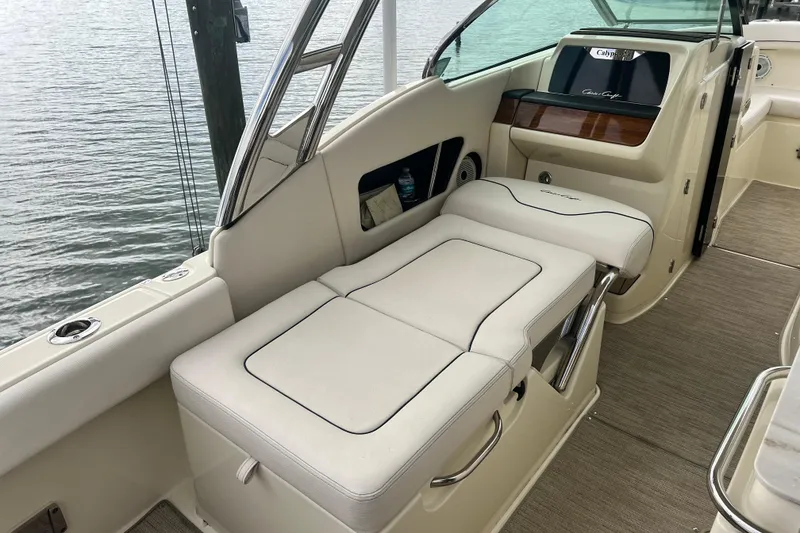 Slide: The Image of 2024 Chris-Craft Calypso 24 boat interior with luxurious seating and elegant design. - 15
