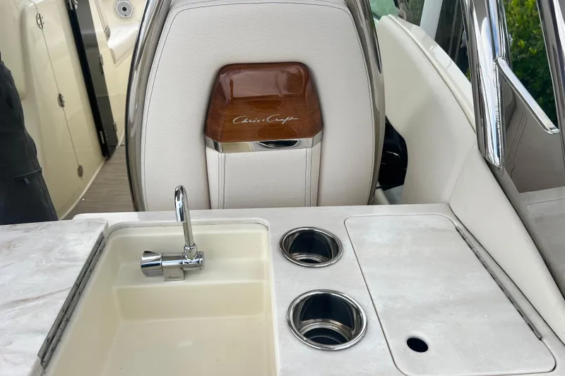Slide: The Image of 2024 Chris-Craft Calypso 24 interior with sink and cup holders. - 16