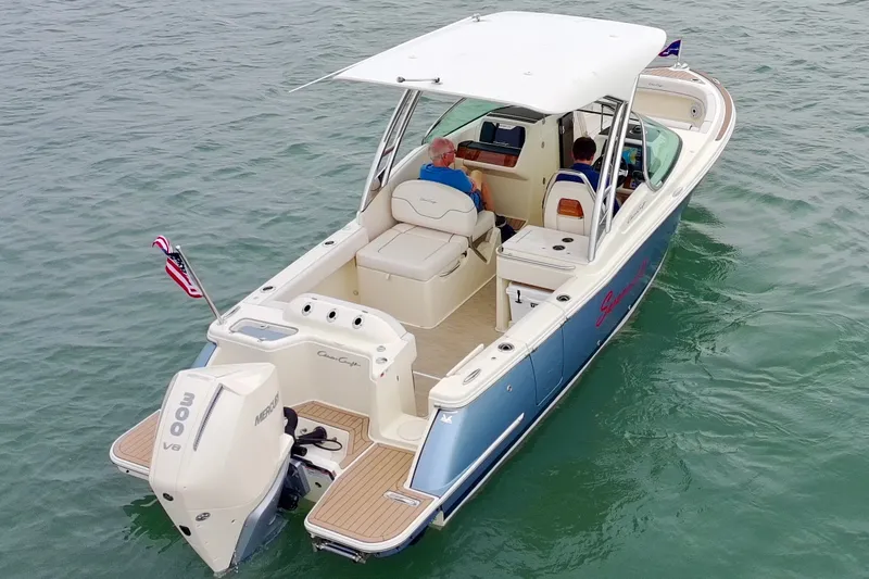 Slide: The Image of 2024 Chris-Craft Calypso 24 boat cruising on water with passengers onboard. - 7