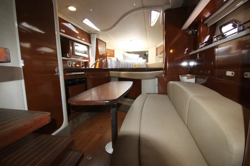Slide: The Image of Interior of 2012 Sea Ray 330 Sundancer yacht with kitchen, dining area, and sleeping quarters. - 30