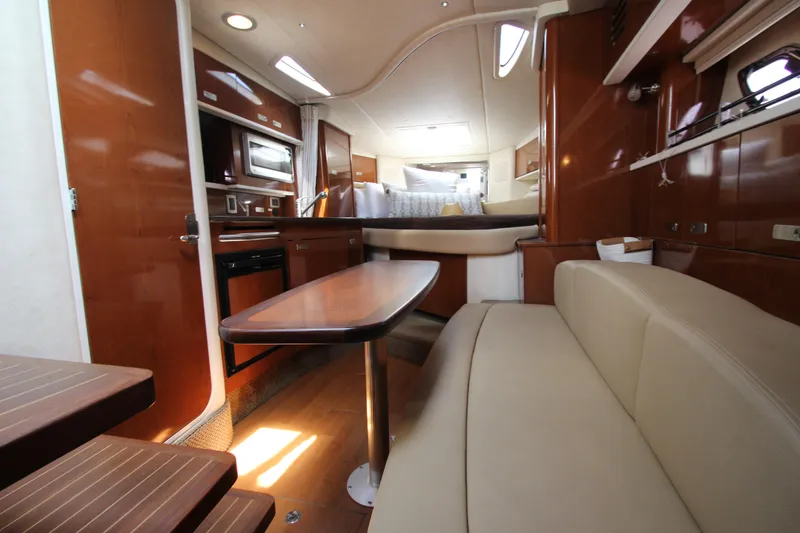 Slide: The Image of Interior of 2012 Sea Ray 330 Sundancer yacht with modern amenities and comfortable seating. - 31