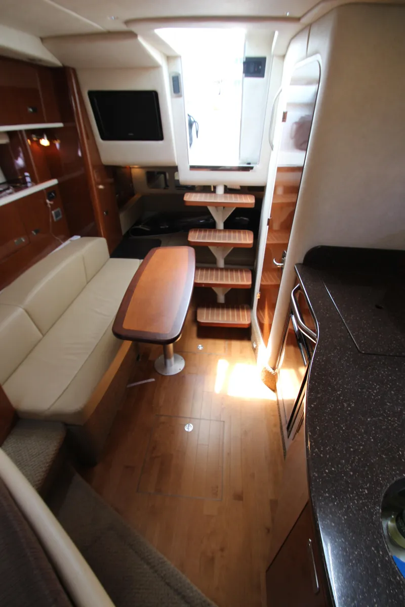 Slide: The Image of Interior of 2012 Sea Ray 330 Sundancer yacht with modern amenities. - 37