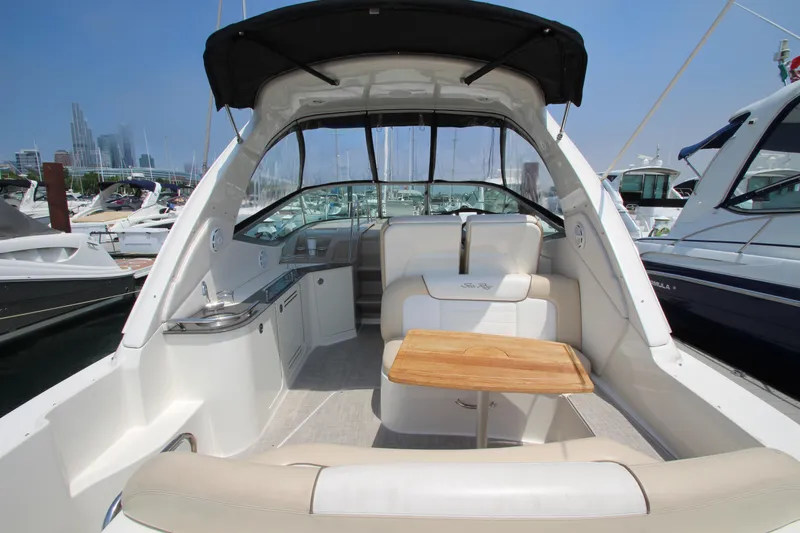 Slide: The Image of 2012 Sea Ray 330 Sundancer yacht interior with seating and table. - 4