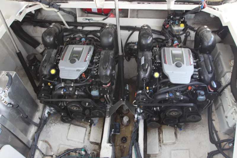 Slide: The Image of 2012 Sea Ray 330 Sundancer engine compartment with twin engines. - 49
