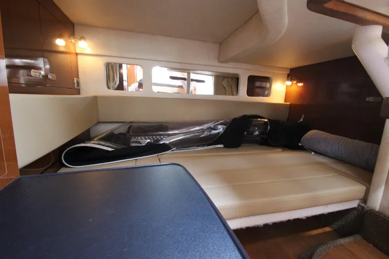 Slide: The Image of Interior cabin of a 2012 Sea Ray 330 Sundancer yacht with seating and storage. - 39