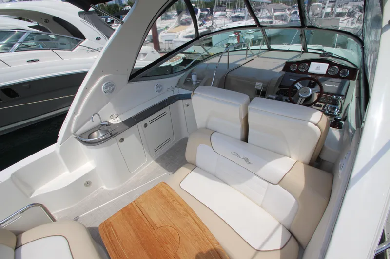 Slide: The Image of Interior of 2012 Sea Ray 330 Sundancer yacht with seating and helm. - 8