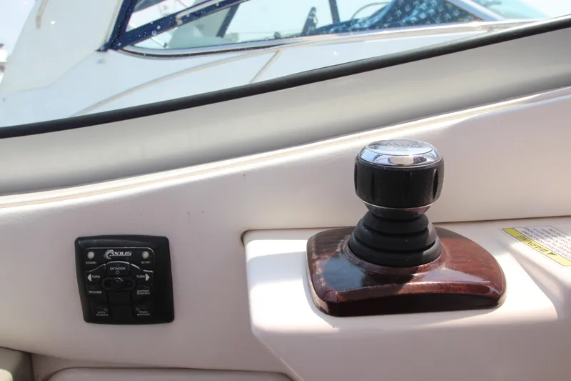 Slide: The Image of Joystick control and panel on a 2012 Sea Ray 330 Sundancer boat. - 16