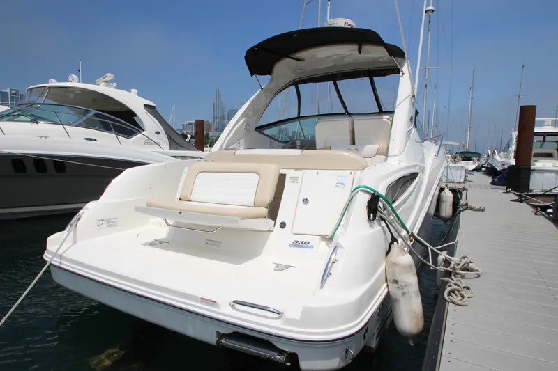 Slide: The Image of 2012 Sea Ray 330 Sundancer yacht docked at marina. - 6
