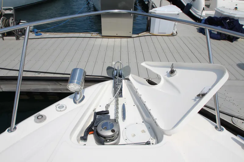 Slide: The Image of 2012 Sea Ray 330 Sundancer bow with anchor locker open at dock. - 23