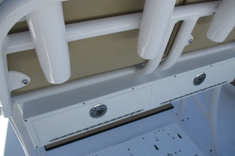 Slide: The Image of 2027 Sportsman Masters 227 Bay Boat interior with rod holders and storage compartments. - 9