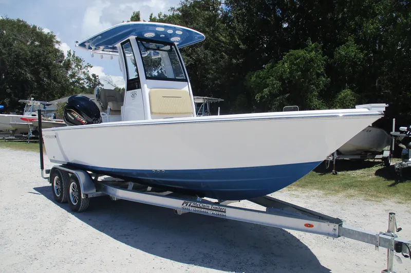 Slide: The Image of 2027 Sportsman Masters 227 Bay Boat on trailer, parked outdoors. - 1
