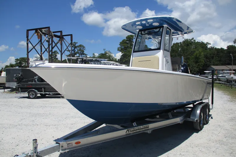 Slide: The Image of 2027 Sportsman Masters 227 Bay Boat on trailer under clear sky. - 3