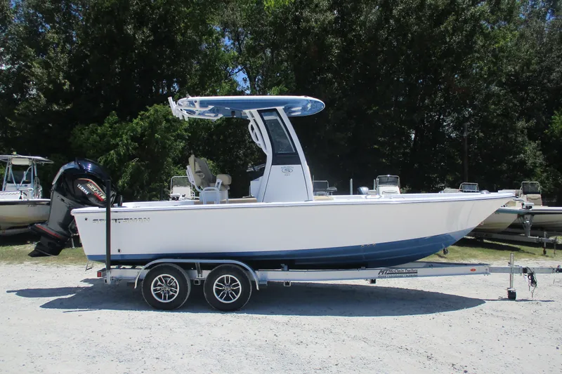 The Image of 2027 Sportsman Masters 227 Bay Boat on trailer, parked outdoors. - 0