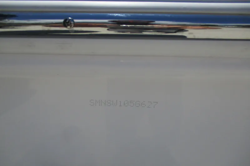Slide: The Image of Hull identification number on a 2027 Sportsman Masters 227 Bay Boat. - 14