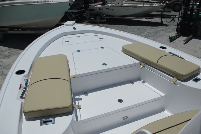 Slide: The Image of 2027 Sportsman Masters 227 Bay Boat interior with cushioned seating and storage compartments. - 11