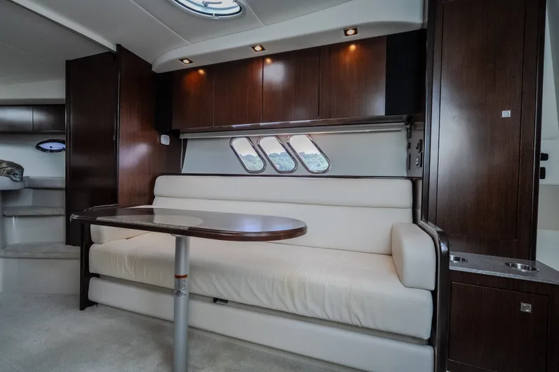 Slide: The Image of Luxurious interior of 2012 Cruisers Yachts 380 Express with elegant seating and wooden cabinetry. - 41