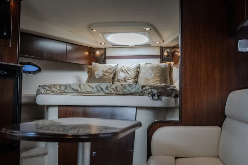 Slide: The Image of Luxurious interior of 2012 Cruisers Yachts 380 Express with elegant bedding and wood finishes. - 50