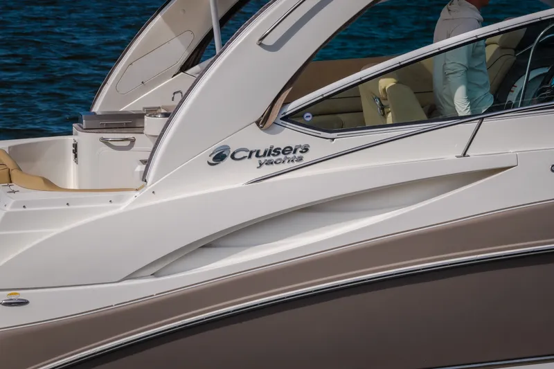 Slide: The Image of 2012 Cruisers Yachts 380 Express, sleek design, docked on water. - 8