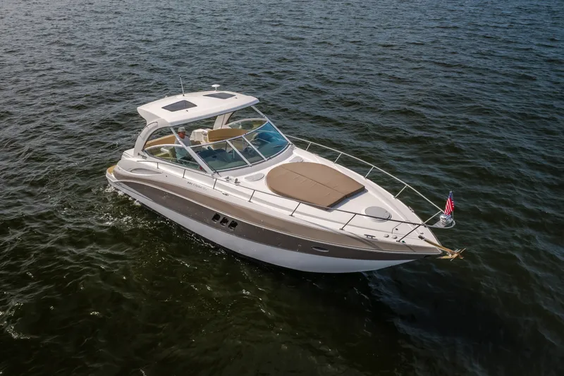 Slide: The Image of 2012 Cruisers Yachts 380 Express on open water, showcasing sleek design and luxury features. - 5