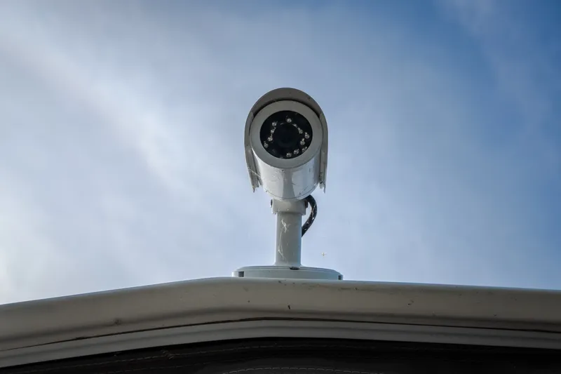 Slide: The Image of Security camera on 2012 Cruisers Yachts 380 Express against a clear sky. - 71