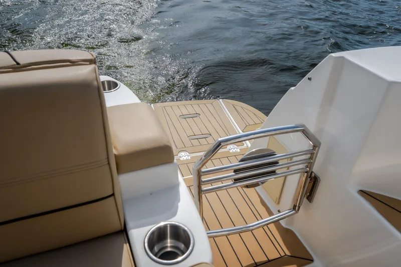 Slide: The Image of 2012 Cruisers Yachts 380 Express swim platform with stainless steel railing on water. - 31