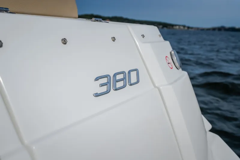 Slide: The Image of 2012 Cruisers Yachts 380 Express boat detail with water backdrop. - 14