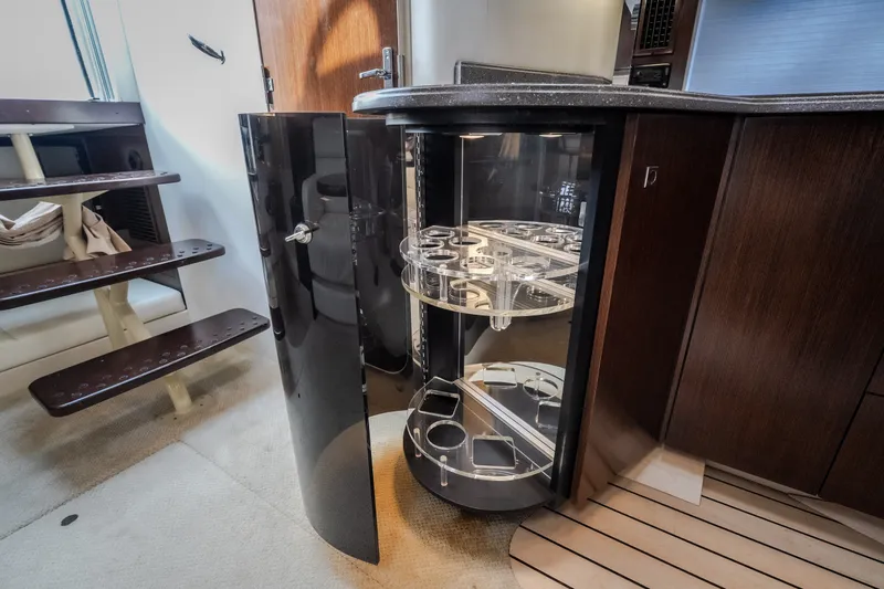 Slide: The Image of Interior of 2012 Cruisers Yachts 380 Express with open cabinet and modern design. - 52