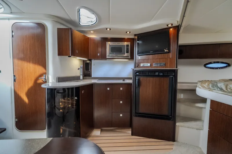 Slide: The Image of Luxurious 2012 Cruisers Yachts 380 Express interior with modern kitchen amenities. - 51