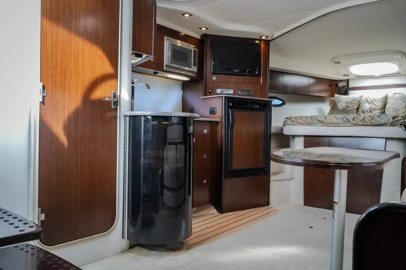 Slide: The Image of Luxurious interior of 2012 Cruisers Yachts 380 Express with wood finishes and modern amenities. - 46