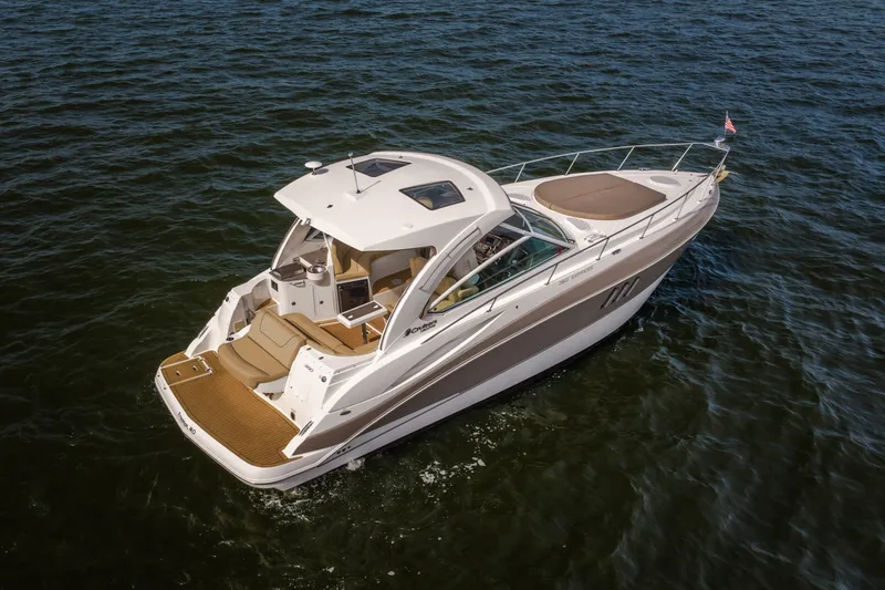 Slide: The Image of 2012 Cruisers Yachts 380 Express on open water, showcasing sleek design and luxury features. - 6