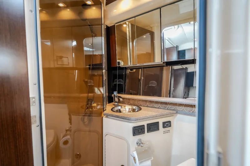 Slide: The Image of Luxurious bathroom interior of 2012 Cruisers Yachts 380 Express, featuring modern fixtures and elegant design. - 48